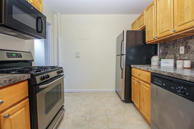 kitchen with stainless steel appliances and decorative backsplash