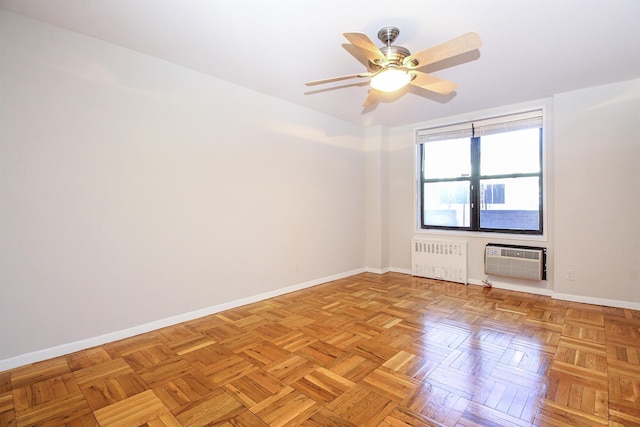 empty room featuring ceiling fan, radiator heating unit, a wall mounted air conditioner, and light parquet floors