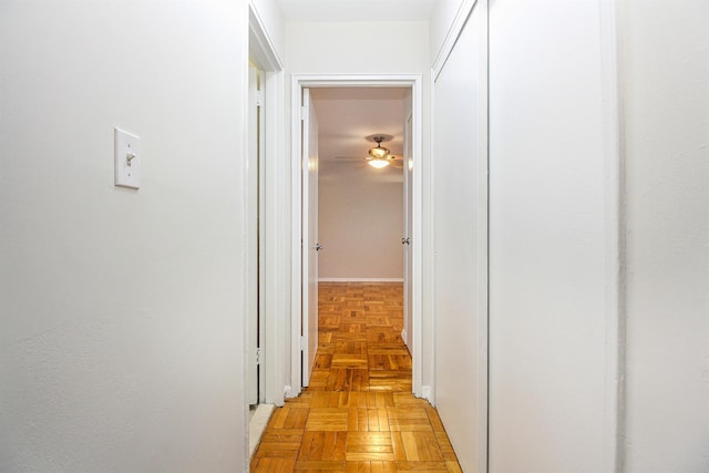 corridor featuring light parquet flooring