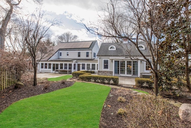 back of house with french doors, a yard, and a patio