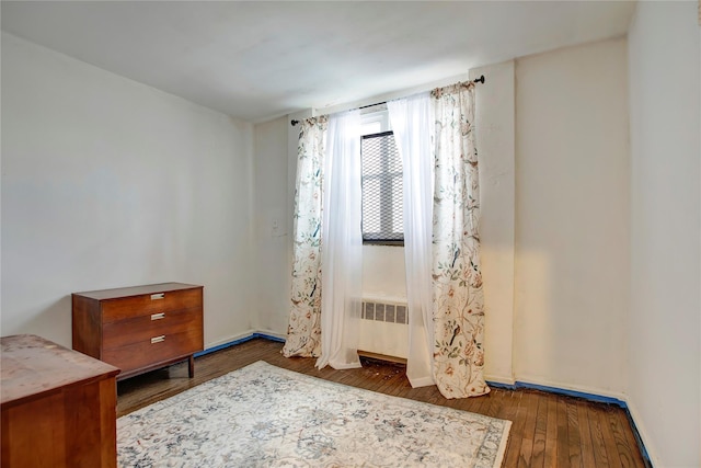 interior space featuring dark wood-type flooring and radiator