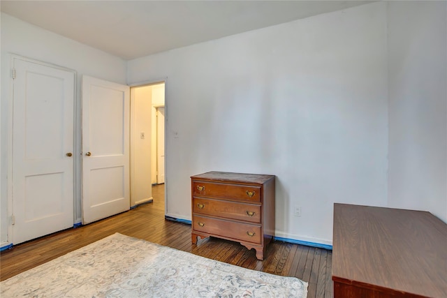 bedroom featuring dark hardwood / wood-style floors