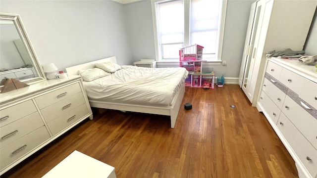 bedroom featuring dark hardwood / wood-style floors