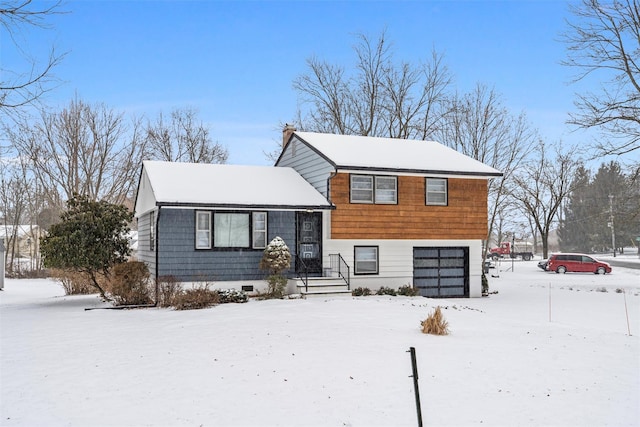 split level home featuring a garage