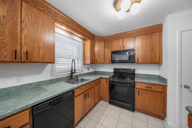 kitchen with sink, black appliances, and light tile patterned flooring