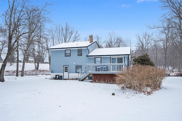 view of snow covered house