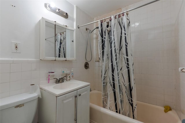 full bathroom featuring vanity, toilet, tile walls, and shower / bath combo with shower curtain