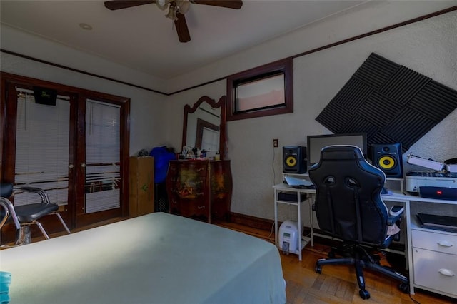 bedroom featuring parquet floors and ceiling fan