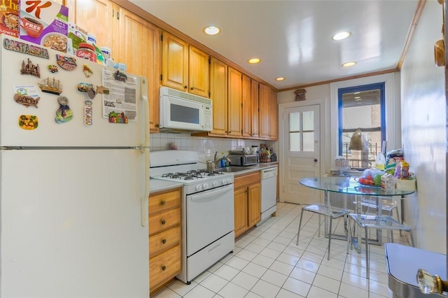 kitchen featuring white appliances, ornamental molding, light tile patterned floors, and backsplash