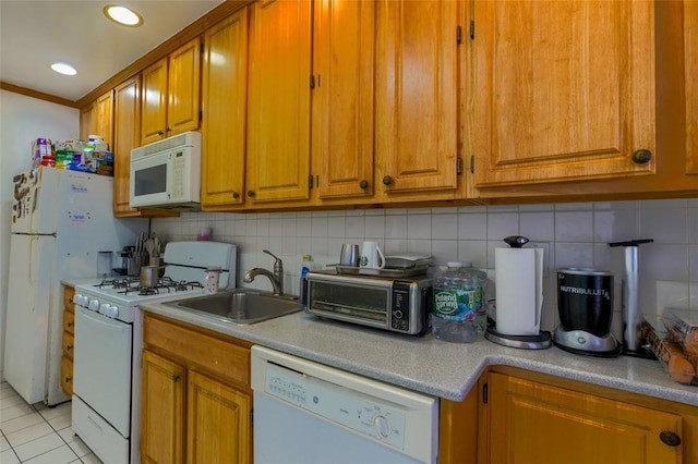 kitchen with light tile patterned flooring, sink, ornamental molding, white appliances, and backsplash