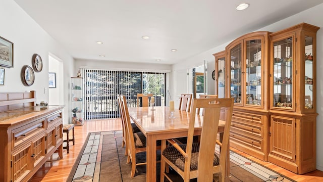 dining area with light hardwood / wood-style floors