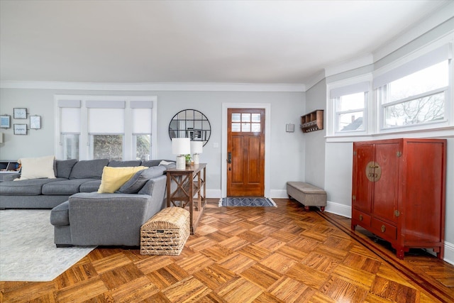 living room with crown molding and parquet floors