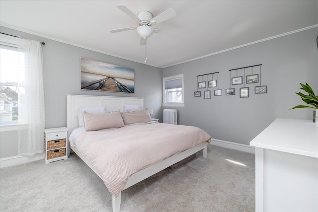 carpeted bedroom with multiple windows, ornamental molding, and radiator