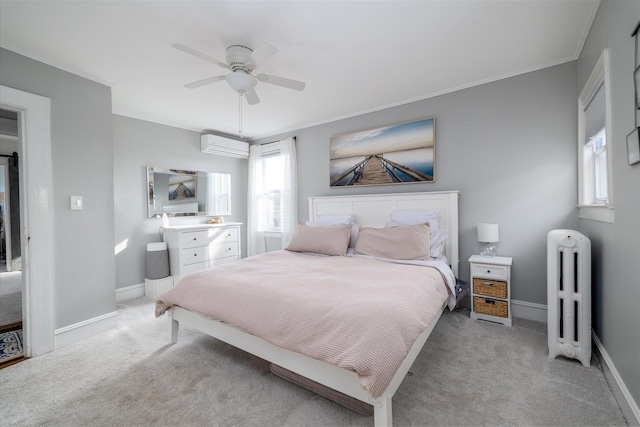 carpeted bedroom with ceiling fan, ornamental molding, radiator heating unit, and a wall unit AC