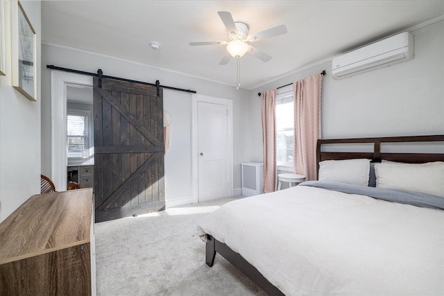 bedroom with a wall mounted air conditioner, carpet flooring, ceiling fan, crown molding, and a barn door