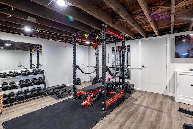 workout area featuring hardwood / wood-style floors