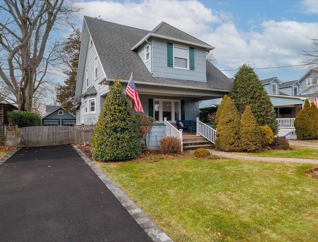 view of front of house with a front lawn and covered porch