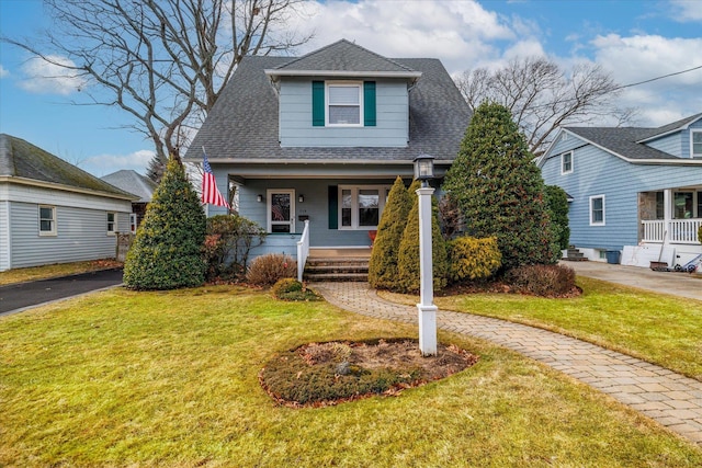 view of front of home with a front lawn and covered porch