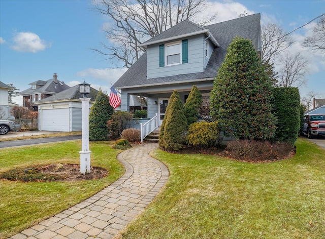 bungalow-style home with a garage, a front yard, and covered porch