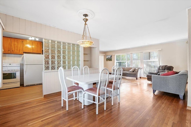 dining area featuring light wood-type flooring