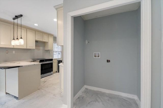 kitchen featuring dishwashing machine, backsplash, stainless steel range with electric stovetop, hanging light fixtures, and cream cabinets