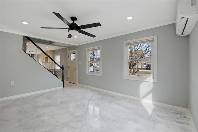 interior space featuring ornamental molding, a wall unit AC, and ceiling fan