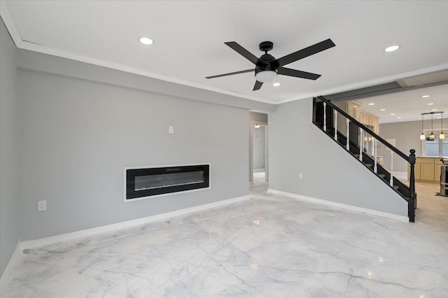 unfurnished living room featuring ceiling fan and ornamental molding