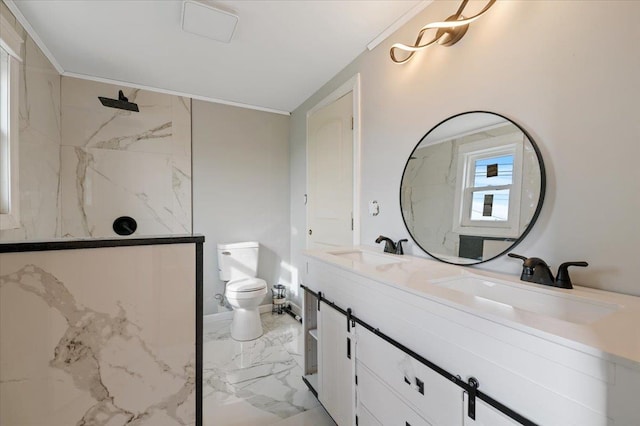 bathroom featuring vanity, a shower, ornamental molding, and toilet