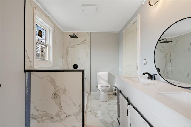 bathroom with vanity, ornamental molding, toilet, and walk in shower