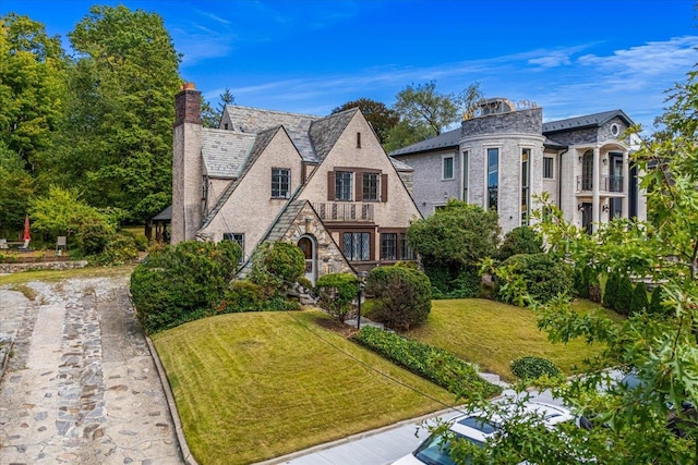 240-25 Alameda Ave, Douglaston, NY 11362 - view of front of home with a front yard, driveway, and stone siding