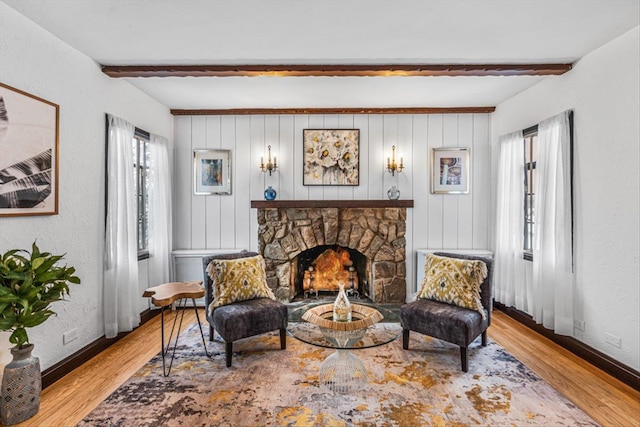 240-25 Alameda Ave, Douglaston, NY 11362 - living area featuring a fireplace, baseboards, beamed ceiling, and wood finished floors