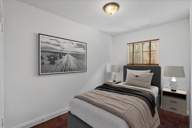 240-25 Alameda Ave, Douglaston, NY 11362 - bedroom featuring brick floor and baseboards