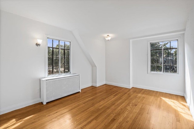 240-25 Alameda Ave, Douglaston, NY 11362 - interior space featuring light wood-type flooring, radiator heating unit, and baseboards