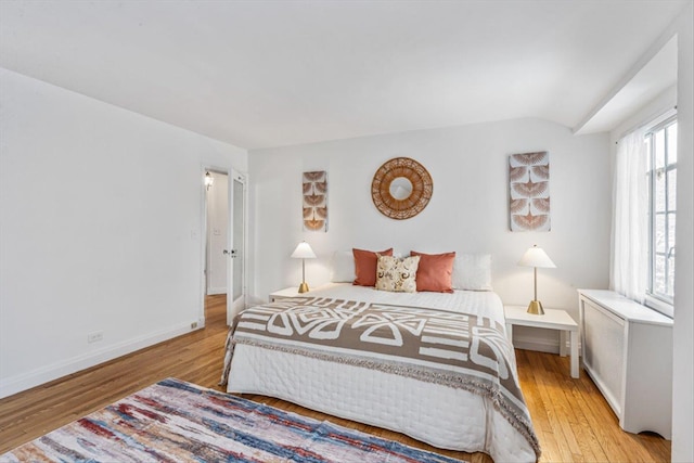 240-25 Alameda Ave, Douglaston, NY 11362 - bedroom featuring wood finished floors, baseboards, and vaulted ceiling