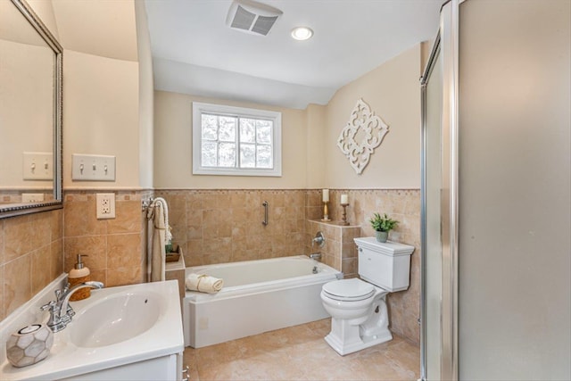 240-25 Alameda Ave, Douglaston, NY 11362 - full bath with visible vents, toilet, a shower stall, and tile walls