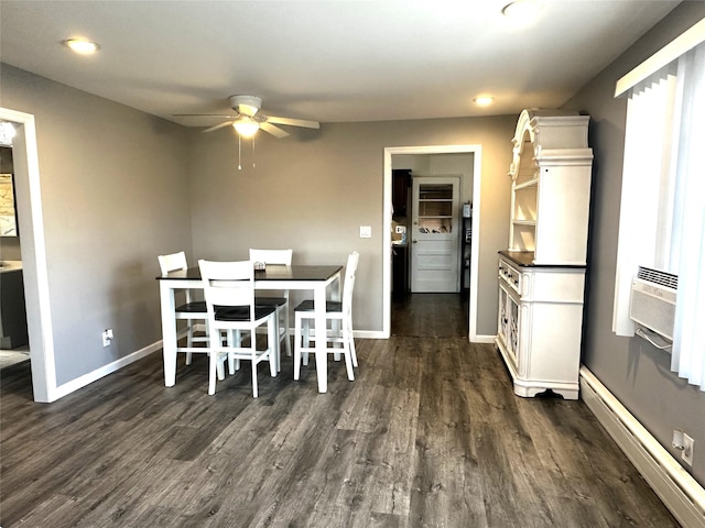 dining area featuring cooling unit, a baseboard heating unit, dark hardwood / wood-style floors, and ceiling fan