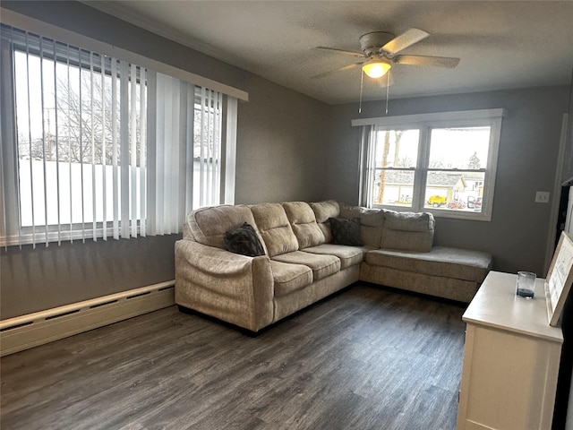 living room featuring a baseboard radiator, dark hardwood / wood-style floors, a textured ceiling, and ceiling fan