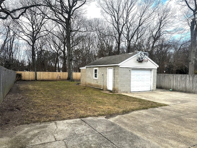 garage featuring a lawn