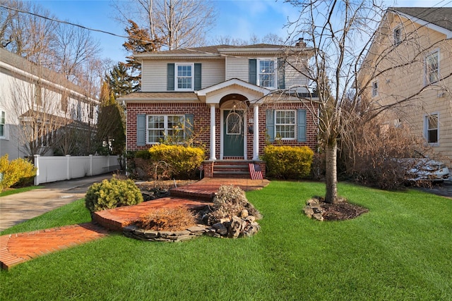 view of property with a front lawn