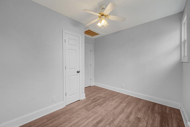 spare room with light hardwood / wood-style floors and ceiling fan