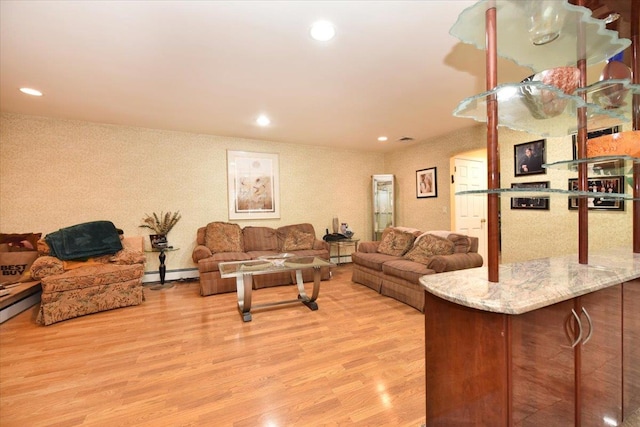 living room featuring baseboard heating, light wood-style flooring, and recessed lighting