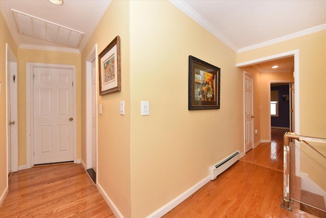 corridor with baseboard heating, light wood finished floors, crown molding, baseboards, and an upstairs landing