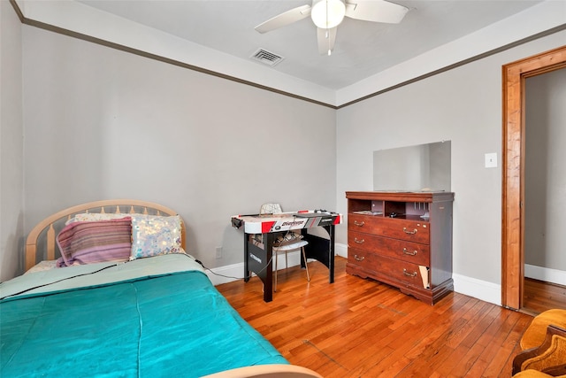 bedroom featuring ceiling fan and hardwood / wood-style floors