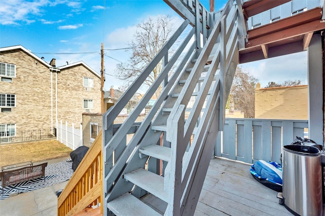 wooden terrace with a grill