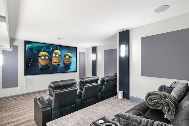 home theater with light hardwood / wood-style flooring