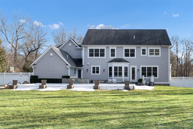 back of house featuring a yard and a patio