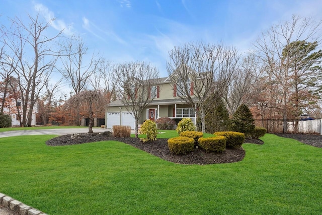 view of front of property featuring a garage and a front lawn