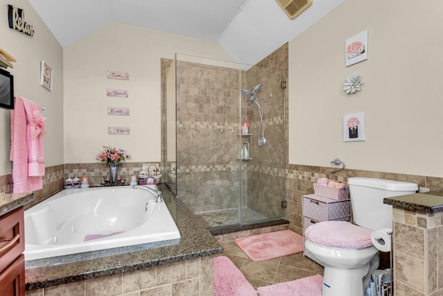 full bathroom with vaulted ceiling, shower with separate bathtub, and tile patterned floors