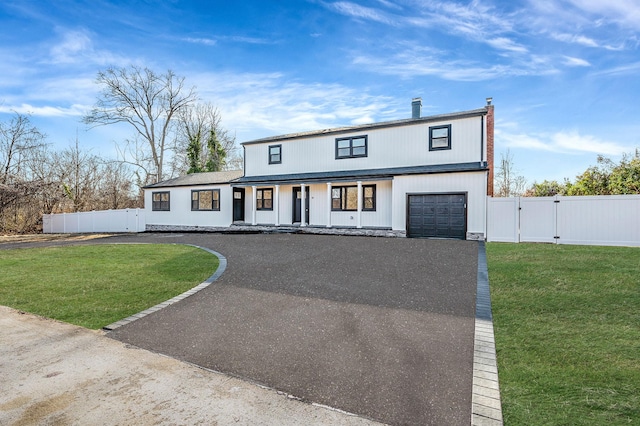 modern farmhouse with a garage and a front lawn