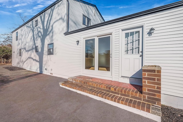 view of side of property with a patio